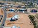 Aerial view of a new home community with several houses under construction at 29408 N 244Th Dr, Wittmann, AZ 85361