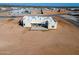 Aerial view of a new home with backyard and surrounding desert landscape at 29408 N 244Th Dr, Wittmann, AZ 85361