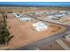 Aerial view showing a new home and surrounding desert landscape at 29408 N 244Th Dr, Wittmann, AZ 85361