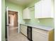 Laundry room with granite countertop and wine cooler at 29408 N 244Th Dr, Wittmann, AZ 85361