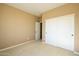Simple bedroom with sliding closet doors and carpet at 29408 N 244Th Dr, Wittmann, AZ 85361