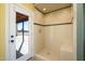 Walk-in shower with tiled walls and built-in bench at 29408 N 244Th Dr, Wittmann, AZ 85361