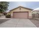 House exterior with a two-car garage and desert landscaping at 505 S 12Th St, Coolidge, AZ 85128