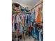 Large walk-in closet with clothing and shoe storage at 51312 N Mockingbird Trl, Wickenburg, AZ 85390