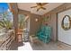 Quaint front porch with rocking chairs at 51312 N Mockingbird Trl, Wickenburg, AZ 85390