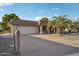 House exterior showcasing a two-car garage and desert landscaping at 10938 W Jacaranda Dr, Sun City, AZ 85373