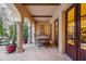 Covered patio with arched columns and dining table at 4949 E Lincoln Dr # 10, Paradise Valley, AZ 85253