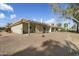 Home with covered patio and desert landscaping at 11405 S Tawa Ln, Phoenix, AZ 85044