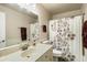 Bathroom with floral shower curtain and updated vanity at 11405 S Tawa Ln, Phoenix, AZ 85044