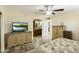 Bright bedroom with wood floors and built-in dresser at 11405 S Tawa Ln, Phoenix, AZ 85044
