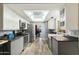 Modern kitchen with gray cabinets, a farmhouse sink, and stainless steel appliances at 11405 S Tawa Ln, Phoenix, AZ 85044