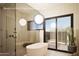 Modern bathroom with freestanding tub, walk-in shower, and natural light at 33094 N Northstar Cir, Scottsdale, AZ 85266