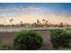 Scenic view of a golf course and mountains at sunset at 7601 E Indian Bend Rd # 1061, Scottsdale, AZ 85250