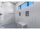 Modern shower with herringbone tile and built-in bench at 8403 E Nightingale Star Dr, Scottsdale, AZ 85266