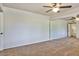 Bright bedroom with mirrored closet doors and neutral carpeting at 12618 W Bonanza Dr, Sun City West, AZ 85375