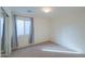 Well-lit bedroom with neutral carpet and window with blinds at 44977 W Miraflores St, Maricopa, AZ 85139