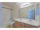 Bathroom with double sinks and a bathtub at 44977 W Miraflores St, Maricopa, AZ 85139