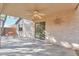 Covered patio with ceiling fan and sliding glass door at 44977 W Miraflores St, Maricopa, AZ 85139