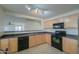 Bright kitchen featuring stainless steel appliances and ample counter space at 44977 W Miraflores St, Maricopa, AZ 85139