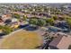 Aerial view of a residential neighborhood showing a house with solar panels at 44977 W Miraflores St, Maricopa, AZ 85139