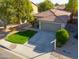 Single-story home with a two-car garage and well-manicured lawn at 44977 W Miraflores St, Maricopa, AZ 85139