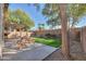 Covered patio with picnic table and grassy area at 44977 W Miraflores St, Maricopa, AZ 85139