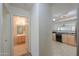 Kitchen and bathroom hallway view at 44977 W Miraflores St, Maricopa, AZ 85139