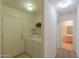 Laundry room with washer, dryer, and additional storage at 44977 W Miraflores St, Maricopa, AZ 85139