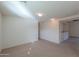 Spacious living room with neutral carpeting and lots of natural light at 44977 W Miraflores St, Maricopa, AZ 85139
