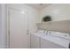 Bright laundry room with washer and dryer hookups at 44977 W Miraflores St, Maricopa, AZ 85139