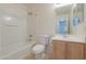 Clean bathroom with a tub, toilet, and vanity at 44977 W Miraflores St, Maricopa, AZ 85139