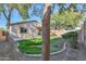 Backyard view with a grassy area and trees at 44977 W Miraflores St, Maricopa, AZ 85139