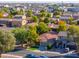 Aerial view of a house and surrounding neighborhood in a suburban setting at 44977 W Miraflores St, Maricopa, AZ 85139