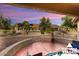 Covered patio with a fire pit and view of the backyard at 14220 W Wagon Wheel Dr, Sun City West, AZ 85375