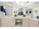 Double vanity bathroom with a large mirror and plenty of storage at 14220 W Wagon Wheel Dr, Sun City West, AZ 85375