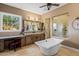 Primary bathroom with soaking tub, walk-in shower, and vanity at 37440 N 104Th Pl, Scottsdale, AZ 85262