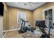 Well-equipped home gym featuring a treadmill, rowing machine, and exercise bike at 37440 N 104Th Pl, Scottsdale, AZ 85262