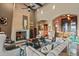 Open living space with high ceilings, a stone fireplace and hardwood floors at 37440 N 104Th Pl, Scottsdale, AZ 85262