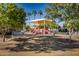 Community playground with shaded areas and play equipment at 1318 S Owl Dr, Gilbert, AZ 85296