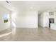 Sunlit living room with tile floors and kitchen view at 4649 N 177Th Dr, Goodyear, AZ 85395