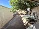 Small backyard with tree and patio furniture at 2434 E Main St # 3, Mesa, AZ 85213