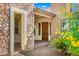 Inviting front door with stone entryway at 7205 W Fallen Leaf Ln, Peoria, AZ 85383