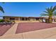 Ranch-style home with a spacious yard and mature landscaping at 10116 W Audrey Dr, Sun City, AZ 85351