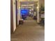 Bright and spacious community hallway with seating and art at 2550 S Ellsworth Rd # 215, Mesa, AZ 85209