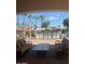 Relaxing community pool area with patio furniture and lush landscaping at 2550 S Ellsworth Rd # 215, Mesa, AZ 85209