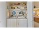 Laundry room with washer, dryer, and shelving at 2550 S Ellsworth Rd # 215, Mesa, AZ 85209