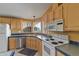 Efficient kitchen with ample cabinetry and modern appliances at 2550 S Ellsworth Rd # 215, Mesa, AZ 85209