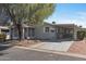 Cozy single-story home with covered carport and screened porch at 2550 S Ellsworth Rd # 215, Mesa, AZ 85209