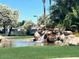 Charming water feature with a pond and waterfall at 2550 S Ellsworth Rd # 215, Mesa, AZ 85209