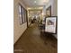 Well-lit community hallway with comfortable seating at 2550 S Ellsworth Rd # 215, Mesa, AZ 85209